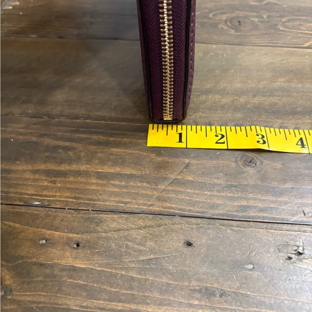 Kate Spade Cameron Street Perforated Rose Lacey Wallet in Deep Plum